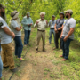 Armed to Farm Texas participants visiting a local orchard